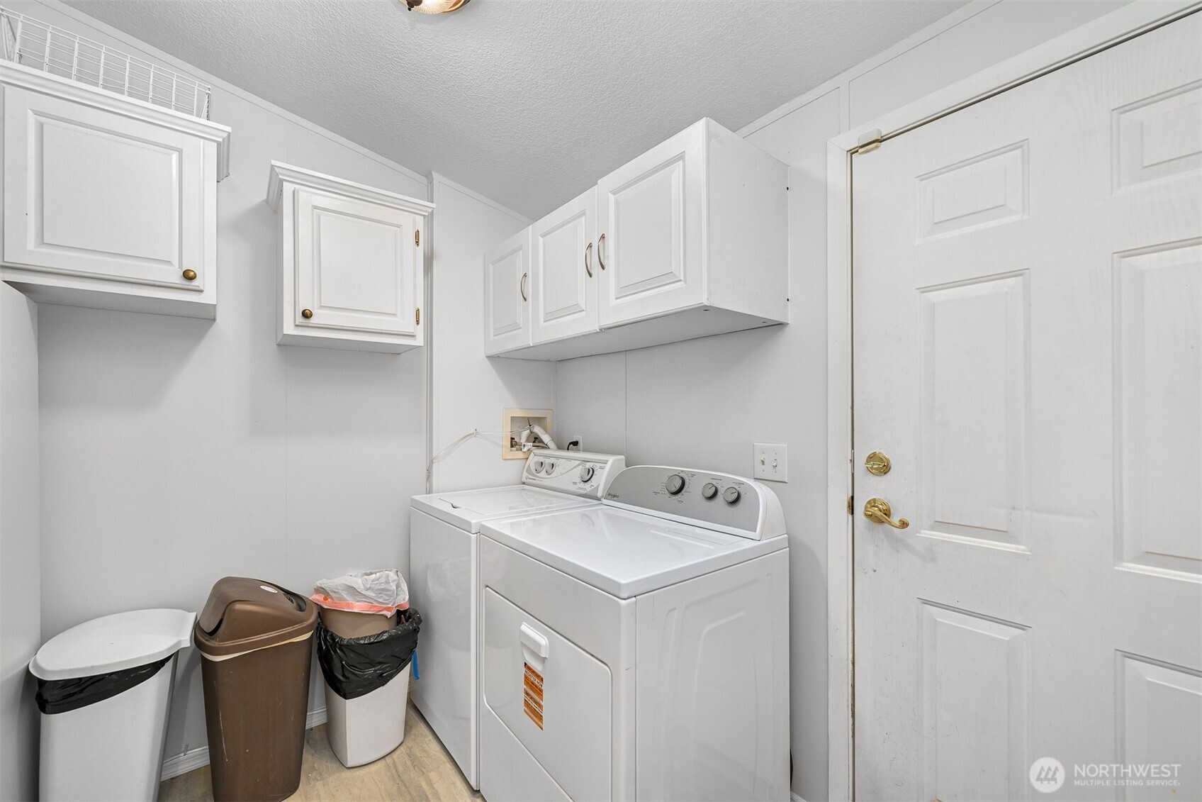 2174 Yew Street Road, Unit 22 Bellingham, WA 98229 - Photo 23 of 36 a utility room with a sink a toilet and cabinets