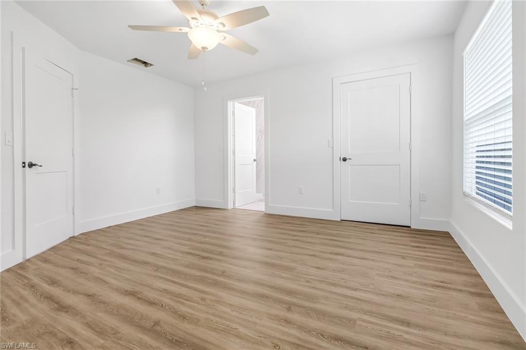 981 11th Street Southwest Naples, FL 34117 - Photo 11 of 24 Unfurnished bedroom featuring light hardwood / wood-style flooring and ceiling fan