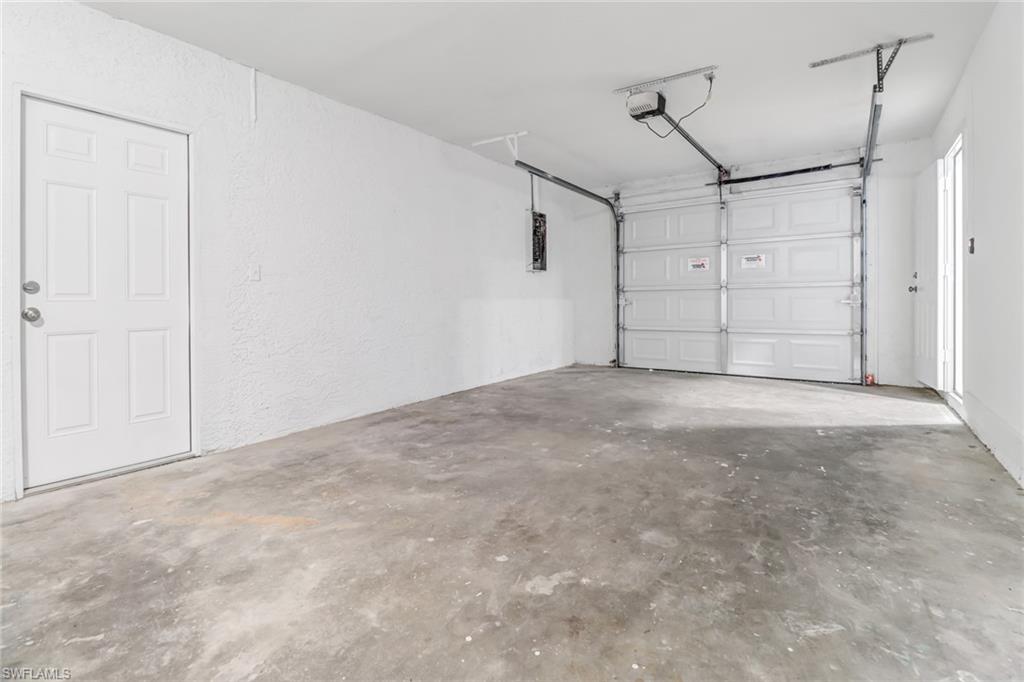 981 11th Street Southwest Naples, FL 34117 - Photo 22 of 24 Garage with a garage door opener