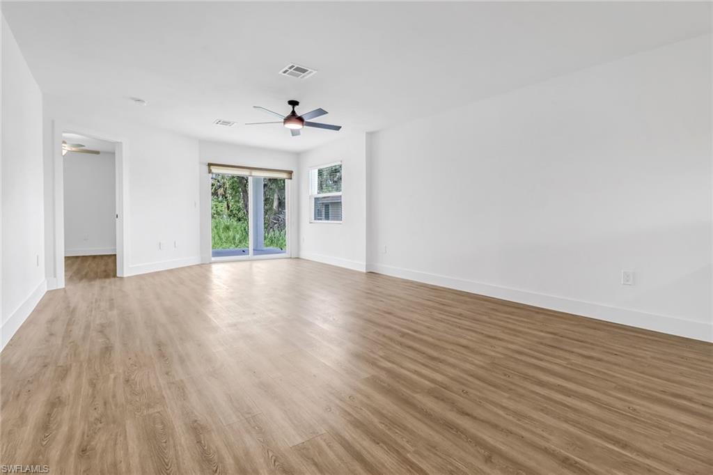 981 11th Street Southwest Naples, FL 34117 - Photo 8 of 24 Unfurnished room featuring ceiling fan and light hardwood / wood-style flooring