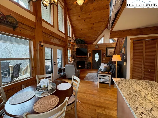 a living room with fireplace furniture and a fireplace