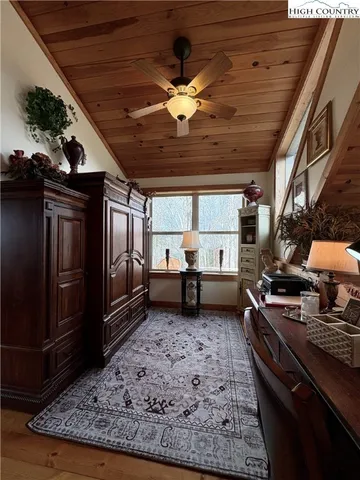 a living room with lots of furniture and a rug