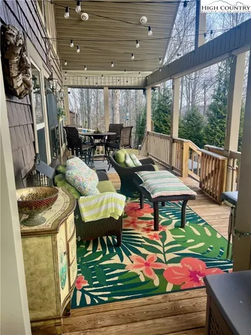 a room with patio furniture and a wooden floor
