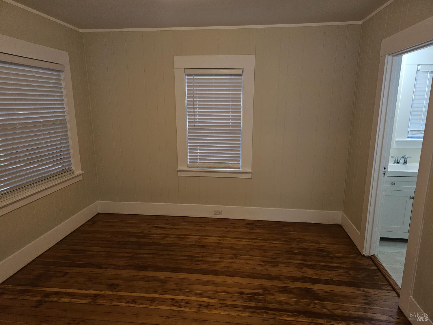 412 Lincoln Street Santa Rosa, CA 95401 - Photo 11 of 35 a view of an empty room with wooden floor and a window