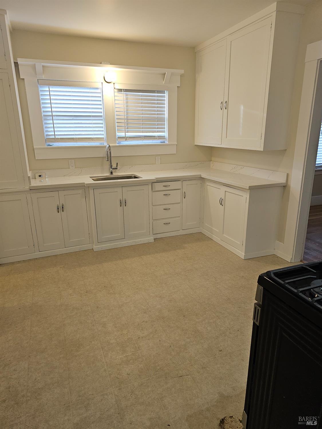 412 Lincoln Street Santa Rosa, CA 95401 - Photo 13 of 35 a view of cabinets and window