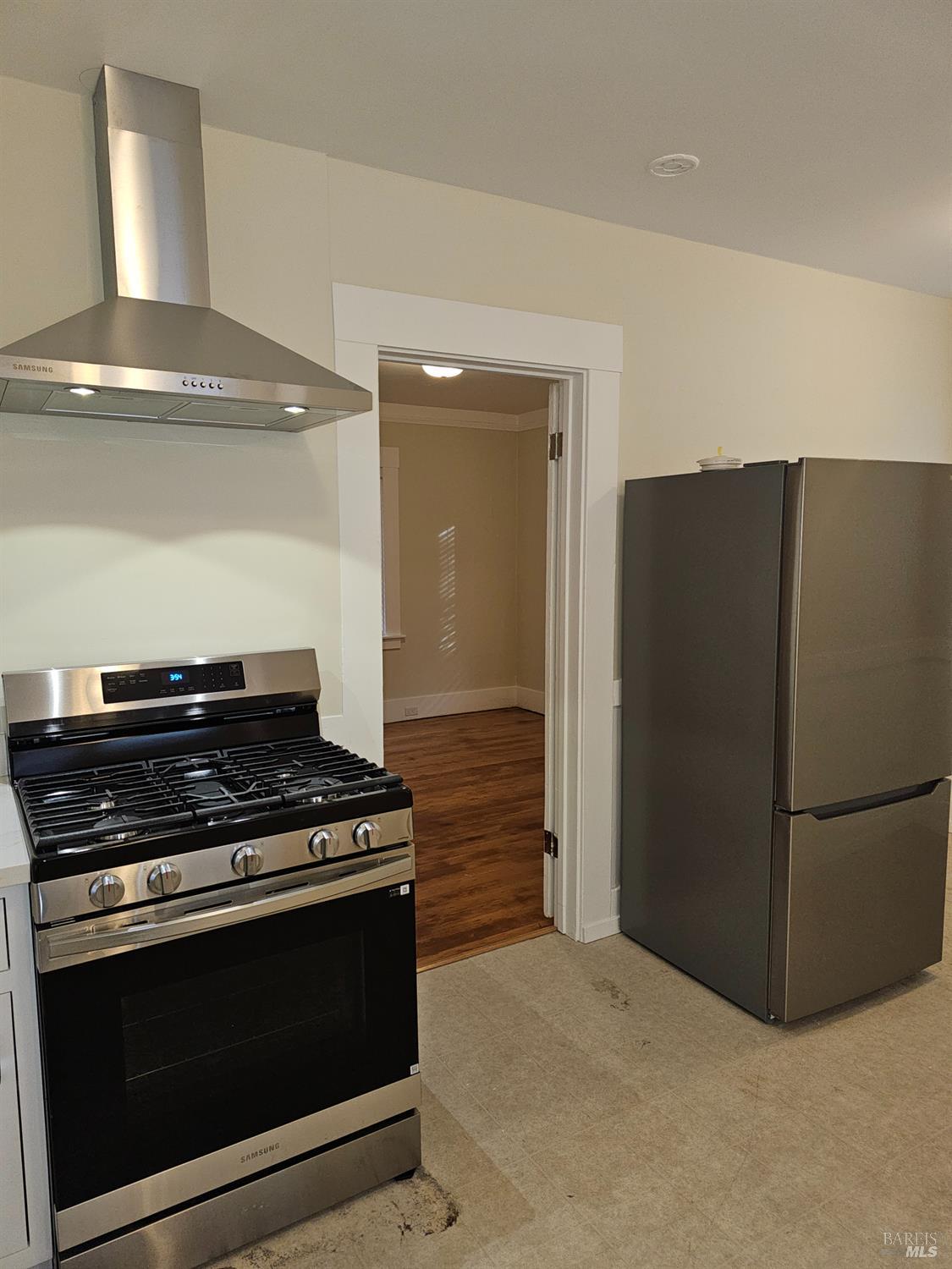 412 Lincoln Street Santa Rosa, CA 95401 - Photo 18 of 35 a kitchen with stainless steel appliances a stove and a refrigerator