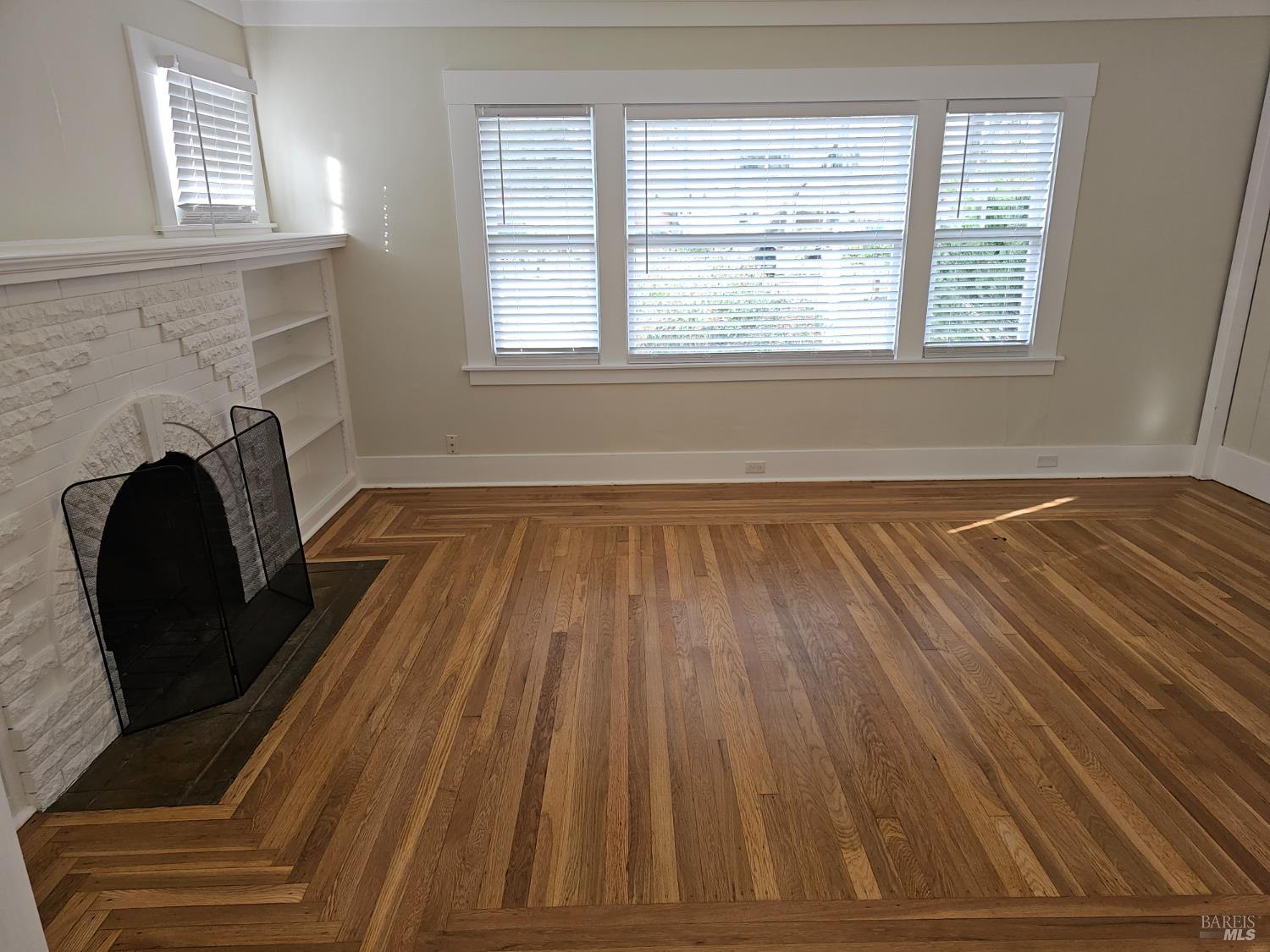 412 Lincoln Street Santa Rosa, CA 95401 - Photo 30 of 35 a view of a livingroom with wooden floor and a fireplace