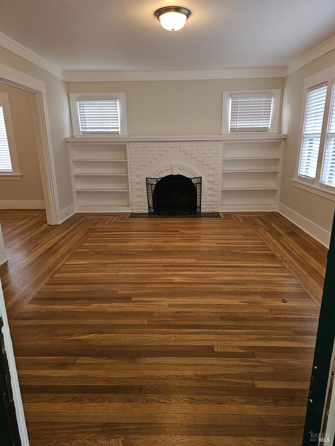 412 Lincoln Street Santa Rosa, CA 95401 - Photo 4 of 35 a view of empty room with fireplace and window