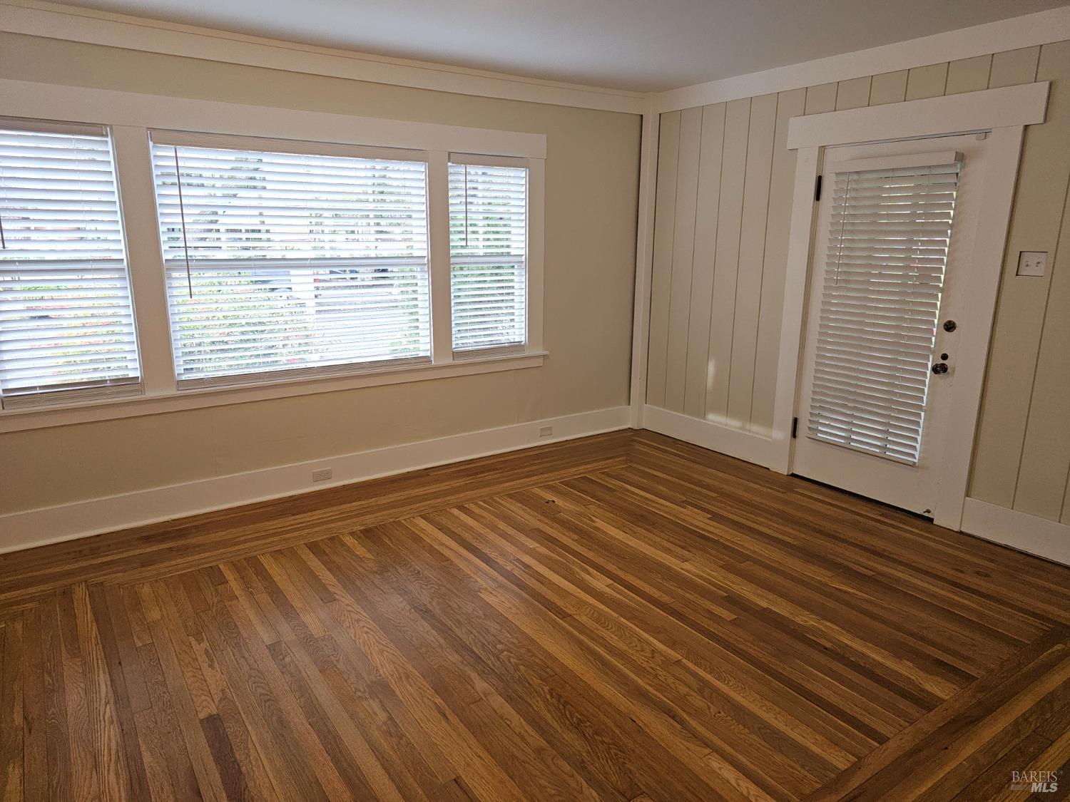412 Lincoln Street Santa Rosa, CA 95401 - Photo 6 of 35 a view of an empty room with wooden floor and a window