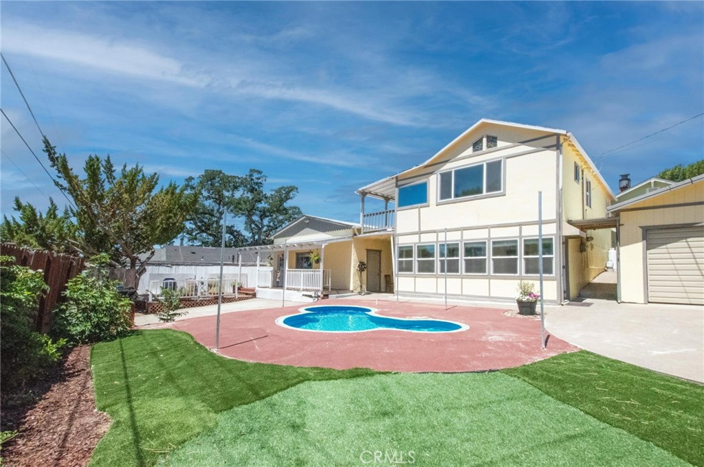 6392 Dixie Road Lucerne, CA 95458 - Photo 1 of 1 a front view of a house with a yard table and chairs