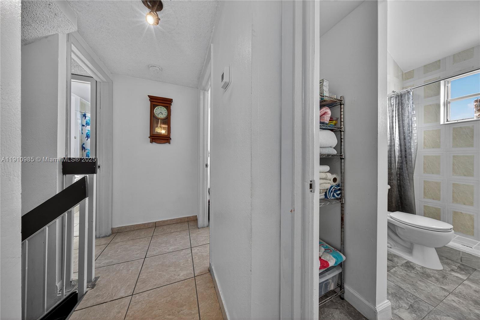 12045 Southwest 18th Street, Unit 142 Miami, FL 33175 - Photo 15 of 18 a bathroom with a toilet and a shower