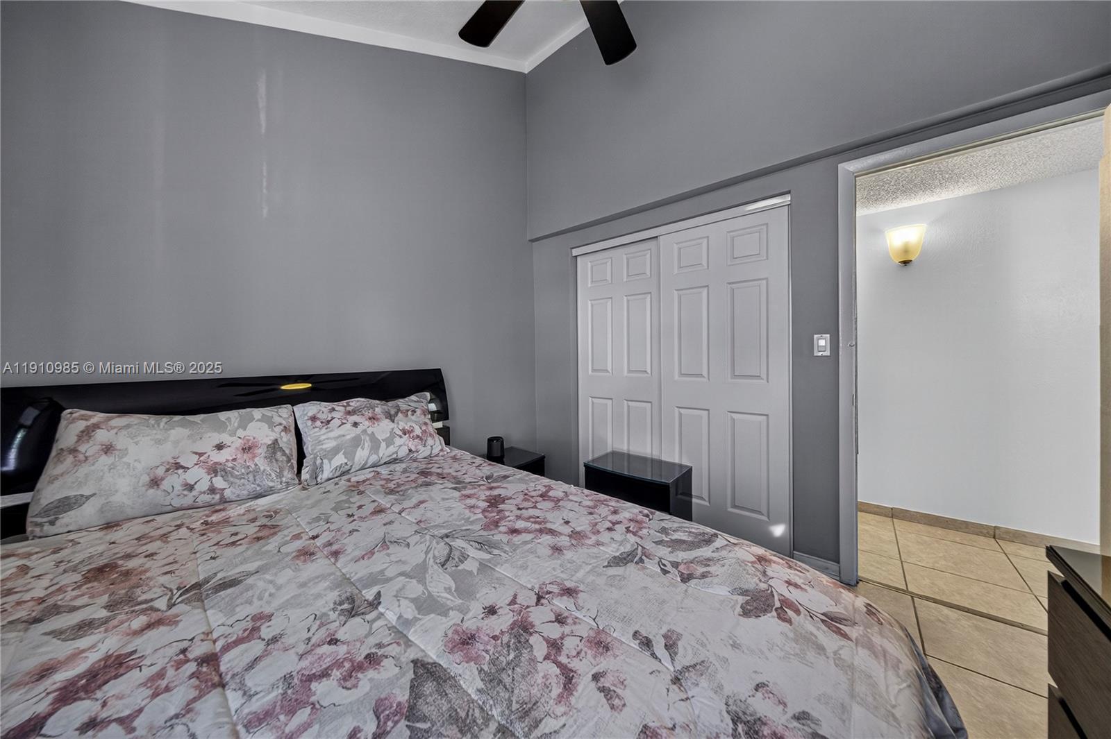 12045 Southwest 18th Street, Unit 142 Miami, FL 33175 - Photo 17 of 18 a bedroom with a large bed and a dresser