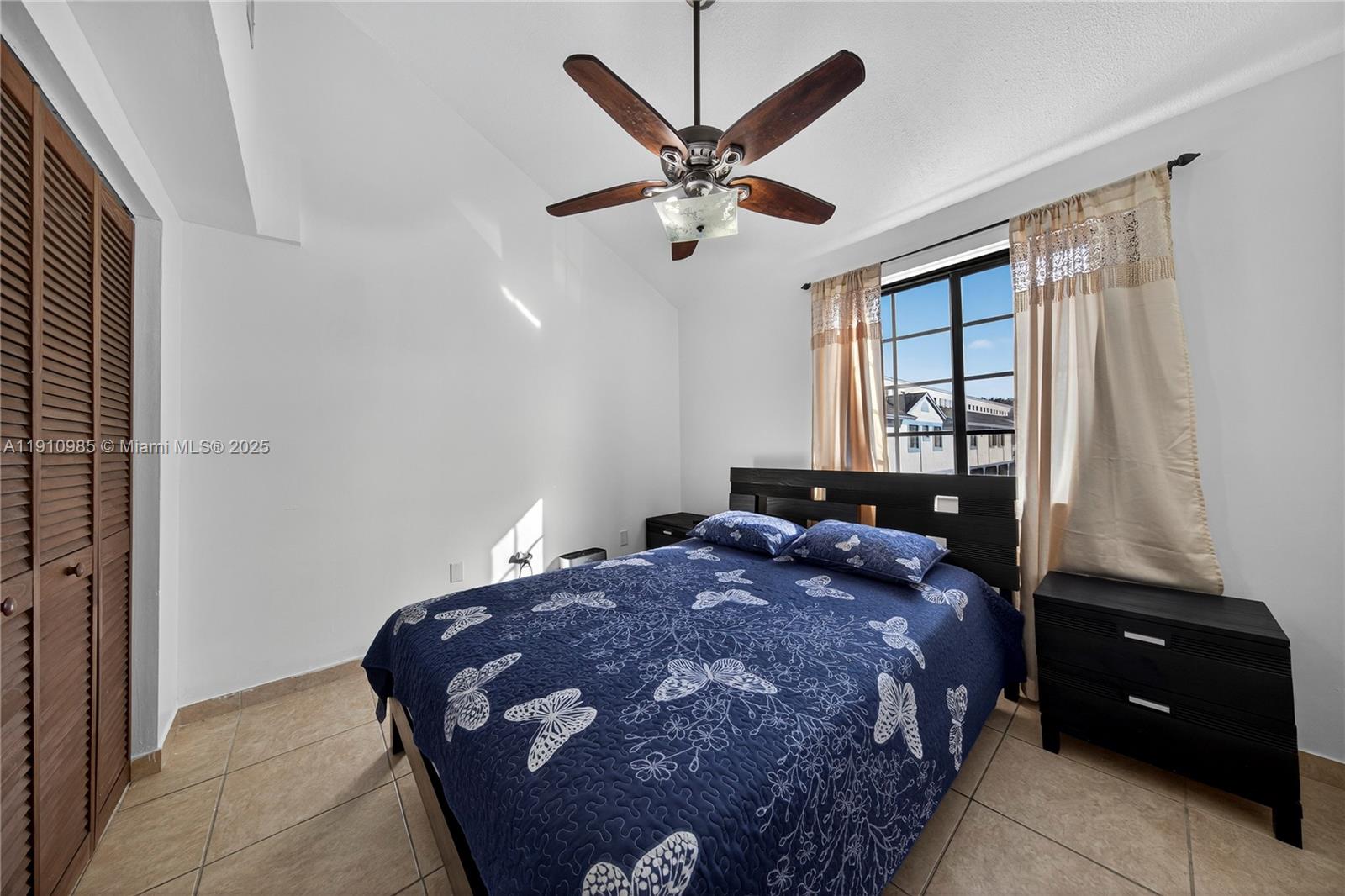 12045 Southwest 18th Street, Unit 142 Miami, FL 33175 - Photo 8 of 18 a bedroom with a bed and window