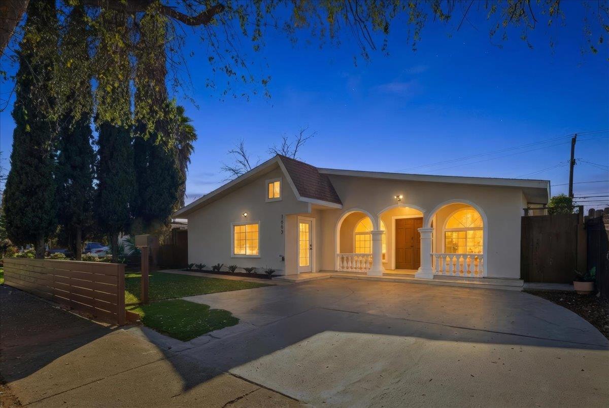 a front view of a house with garden