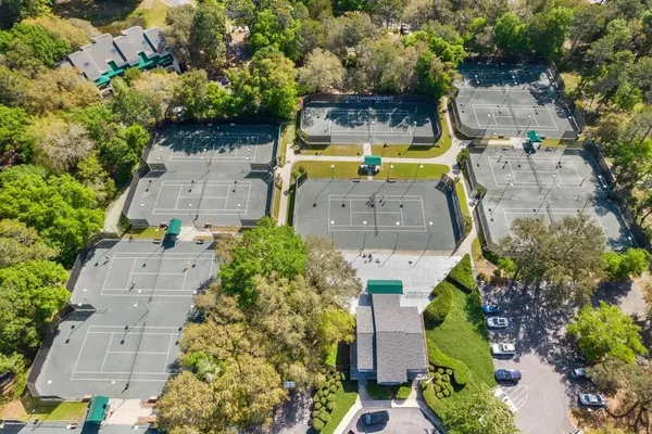 an aerial view of a house with a swimming pool