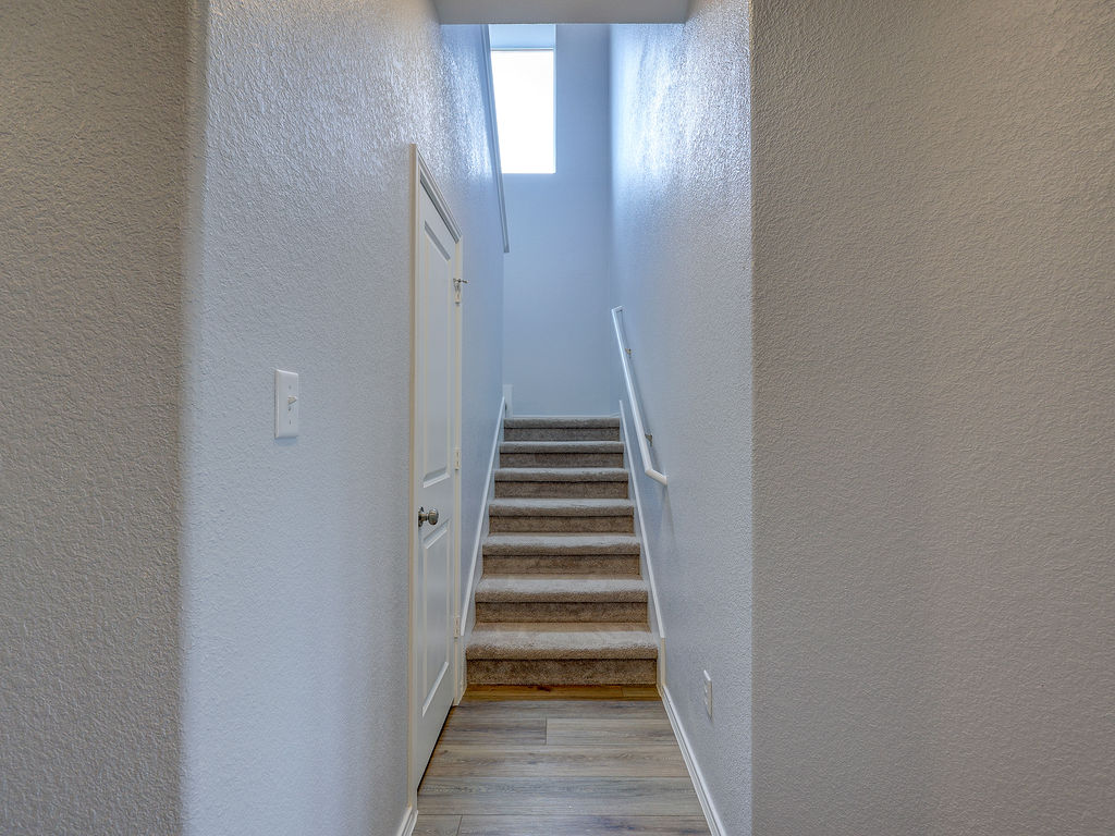 1716 Frontenac Street Leander, TX 78641 - Photo 6 of 34 a view of a hallway with wooden floor and entryway