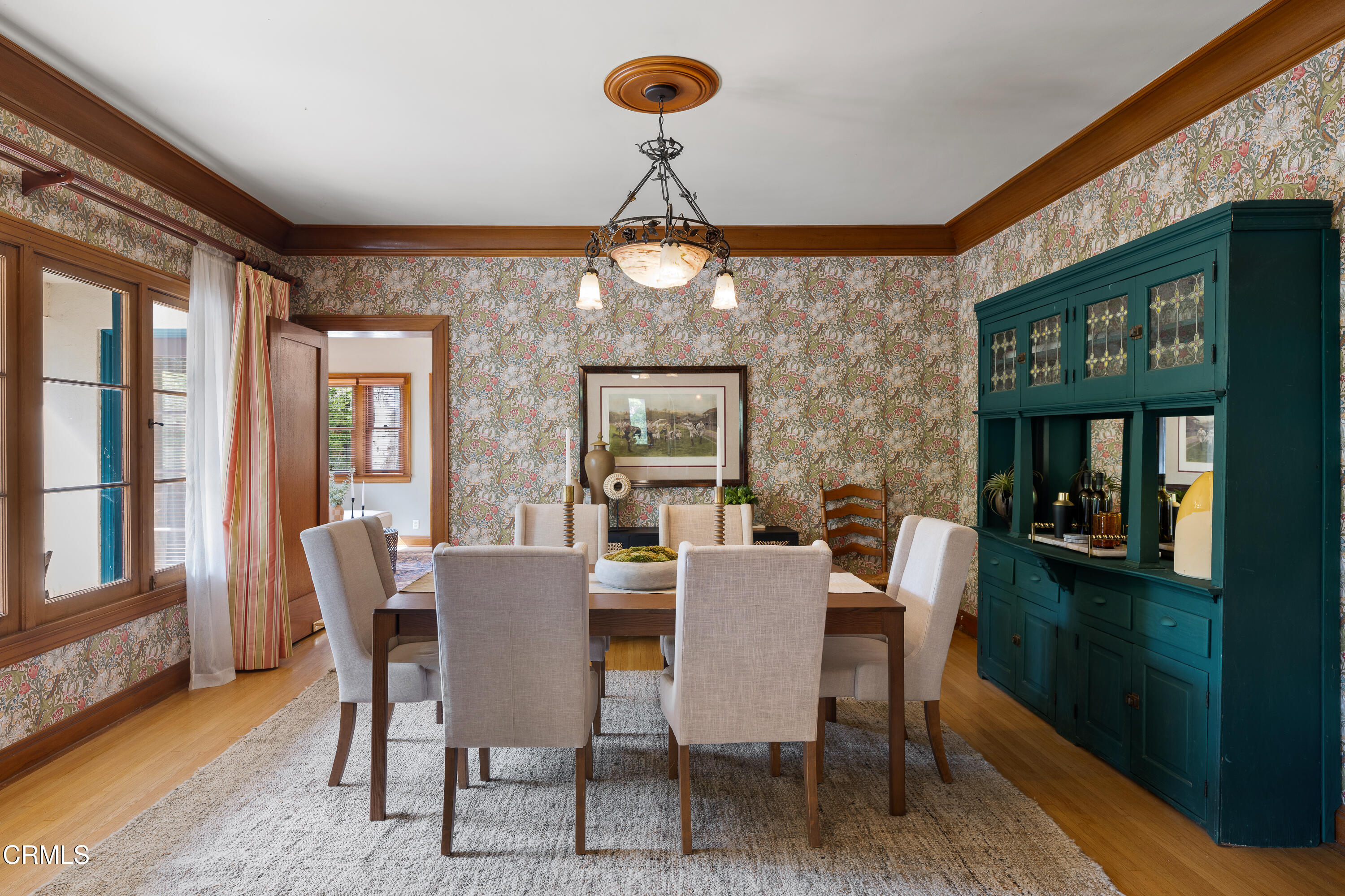 1073 Atchison Street Pasadena, CA 91104 - Photo 14 of 66 a dining room with furniture a window and chandelier