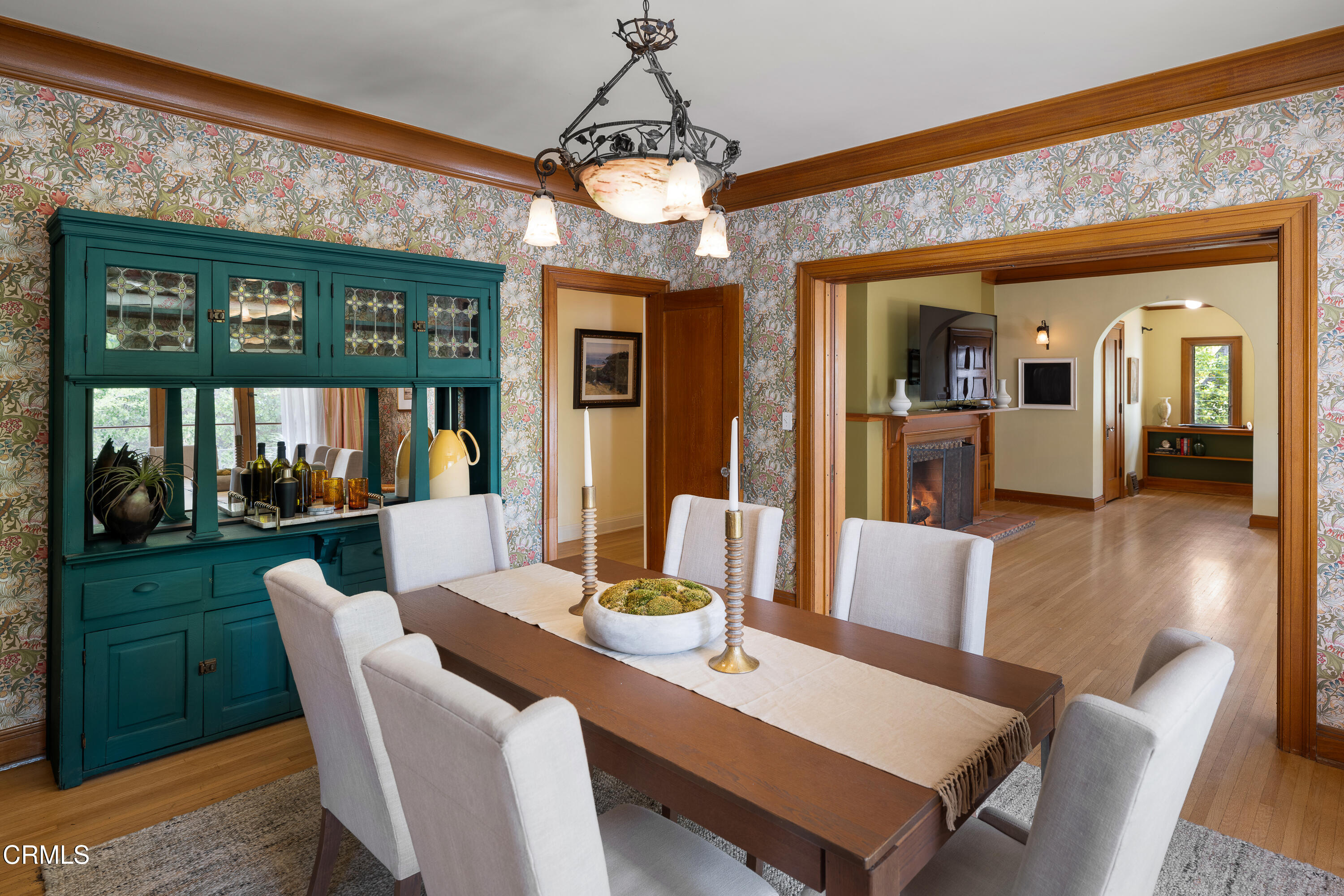 1073 Atchison Street Pasadena, CA 91104 - Photo 16 of 66 a dining room with furniture a chandelier and wooden floor
