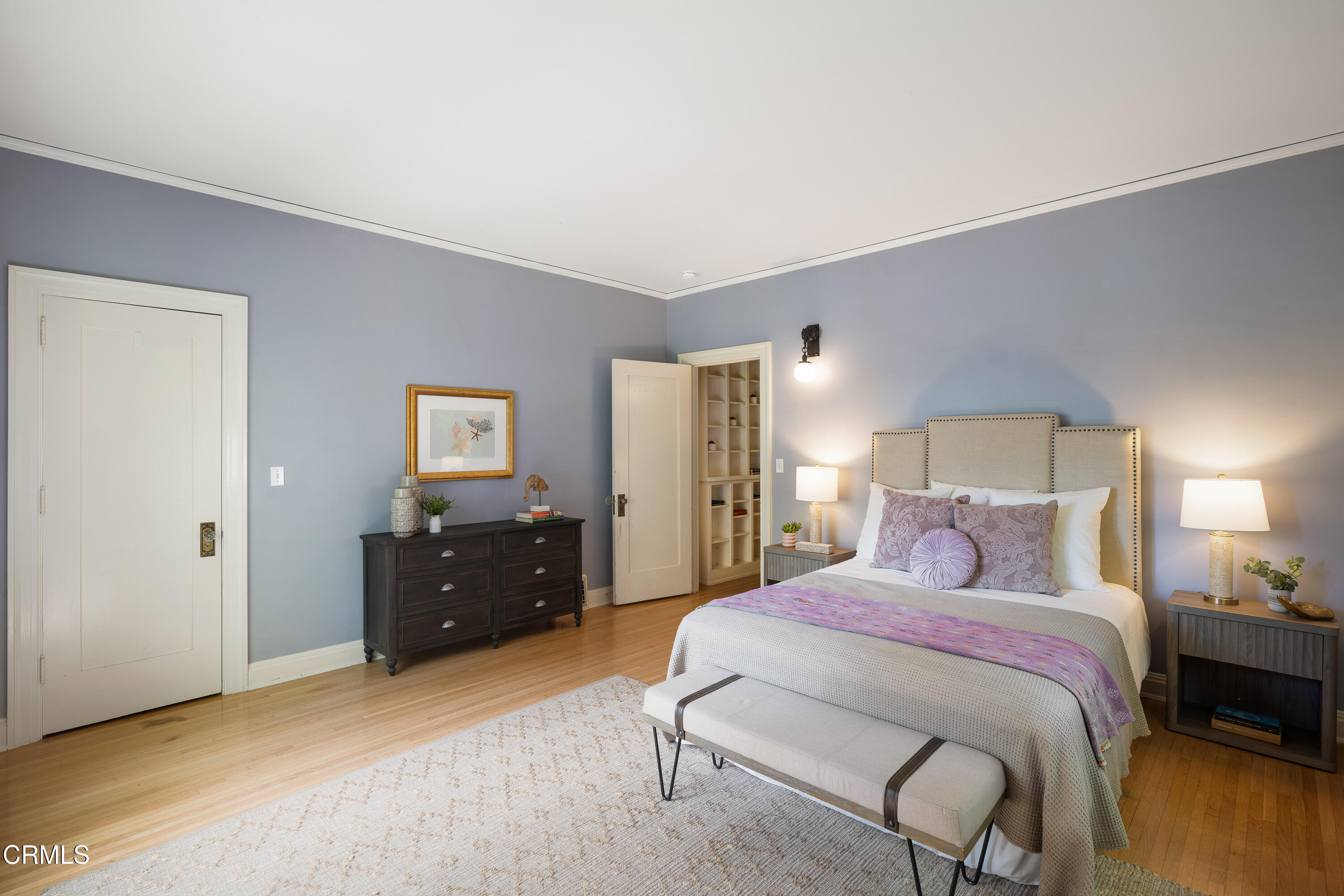 1073 Atchison Street Pasadena, CA 91104 - Photo 27 of 66 a bedroom with a bed and lamp on dresser