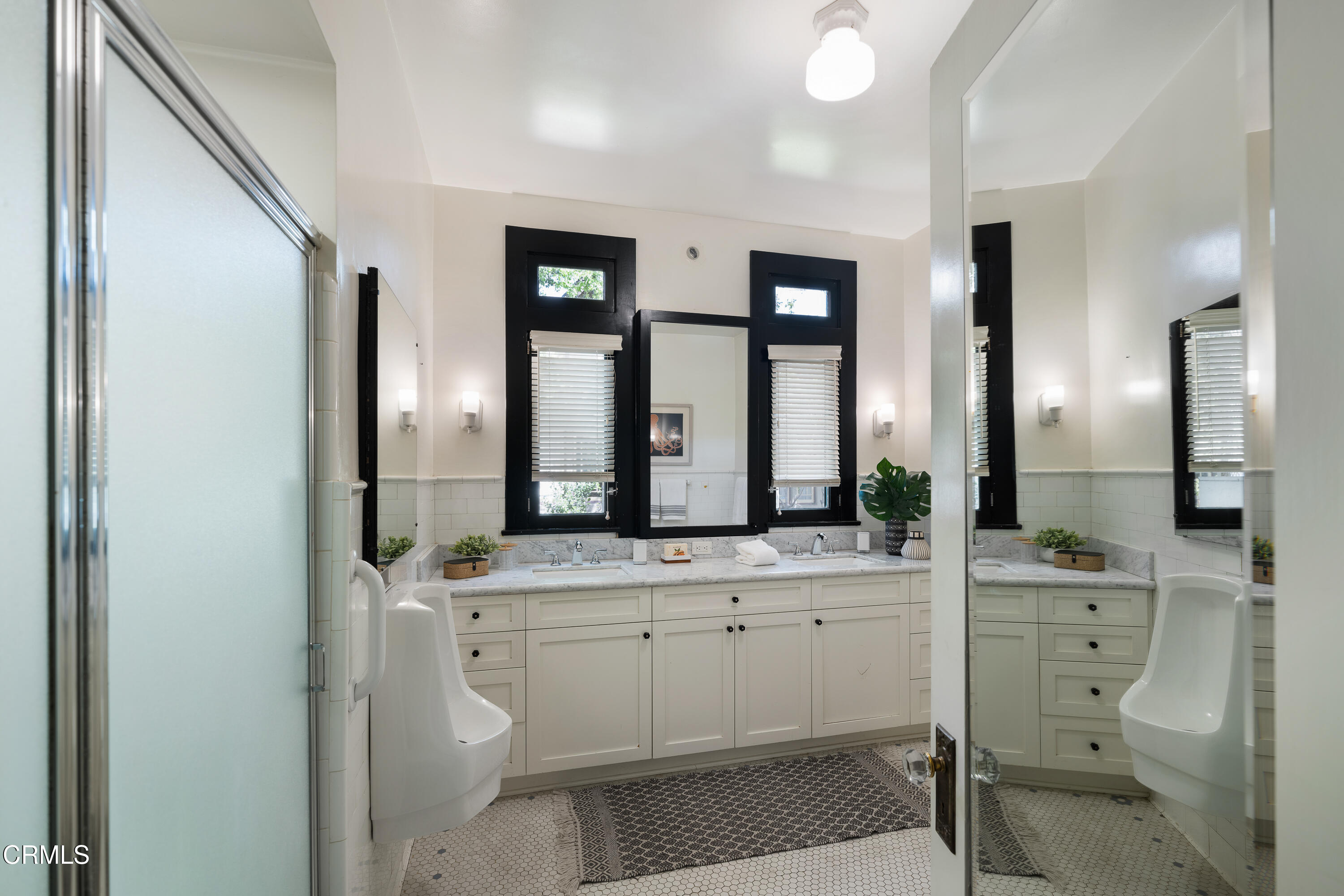 1073 Atchison Street Pasadena, CA 91104 - Photo 29 of 66 a bathroom with a granite countertop sink and a mirror