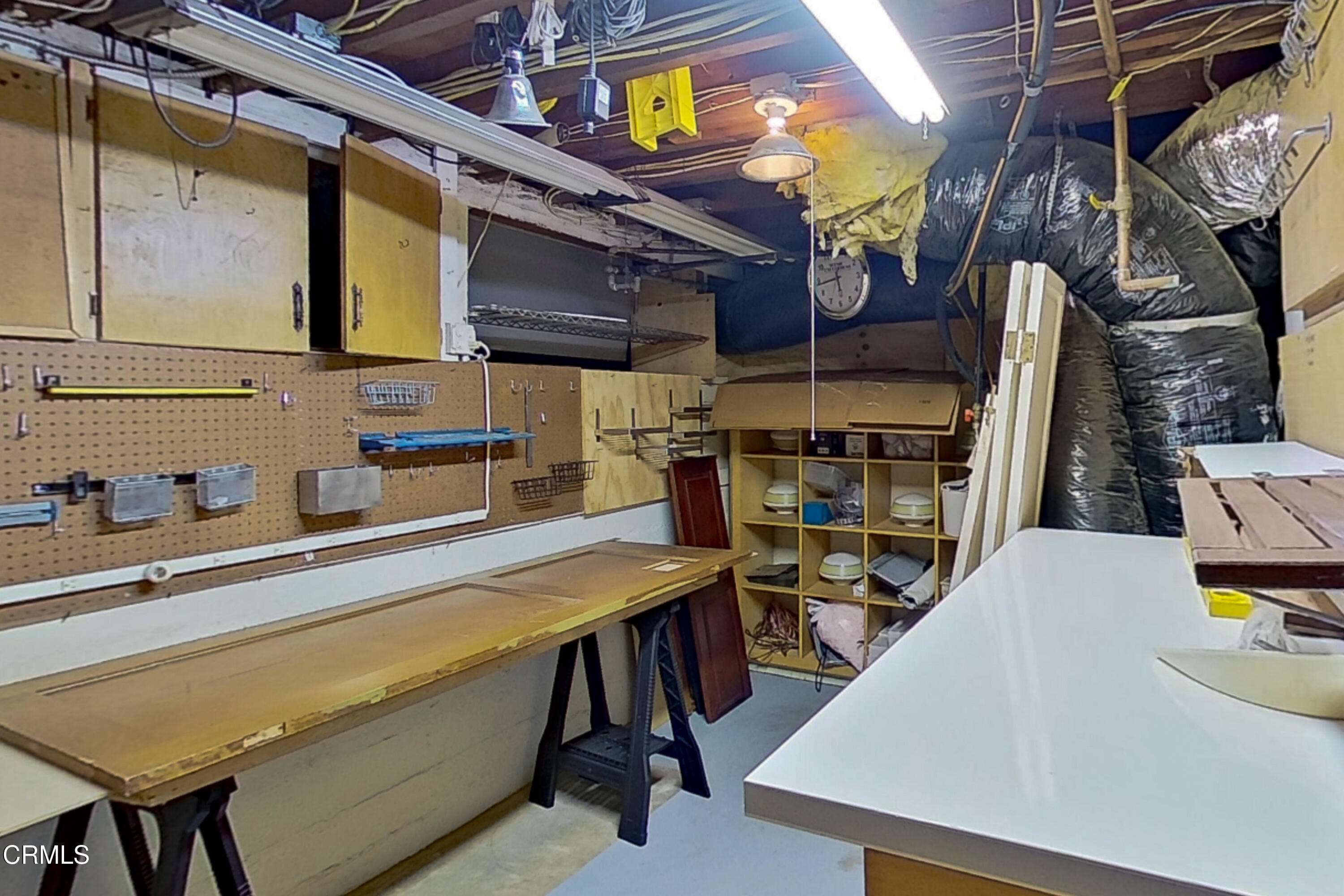 1073 Atchison Street Pasadena, CA 91104 - Photo 44 of 66 a room with stainless steel appliances kitchen island a table chairs in it and a wooden floor