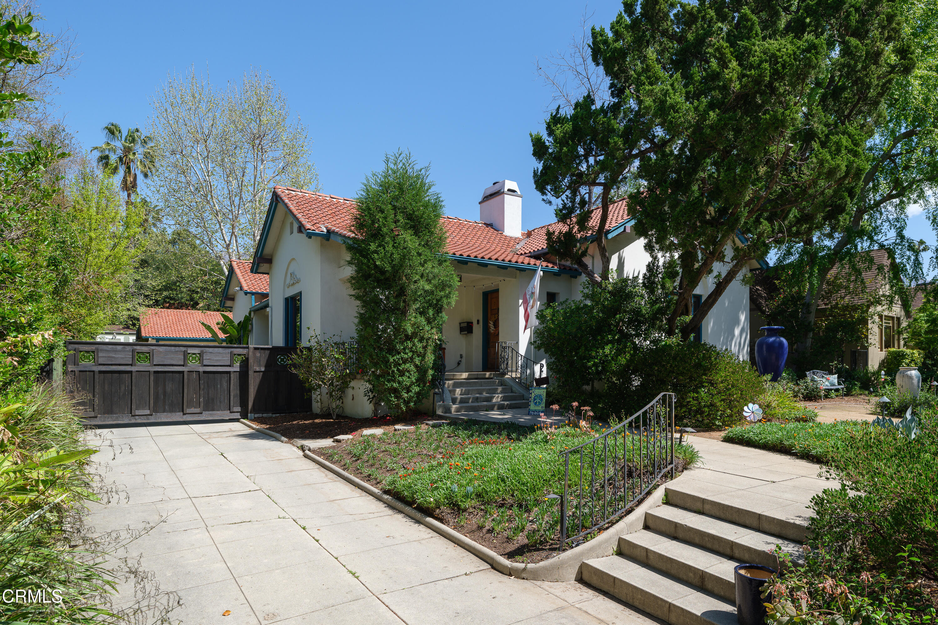 1073 Atchison Street Pasadena, CA 91104 - Photo 5 of 66 a view of a house with a yard and potted plants