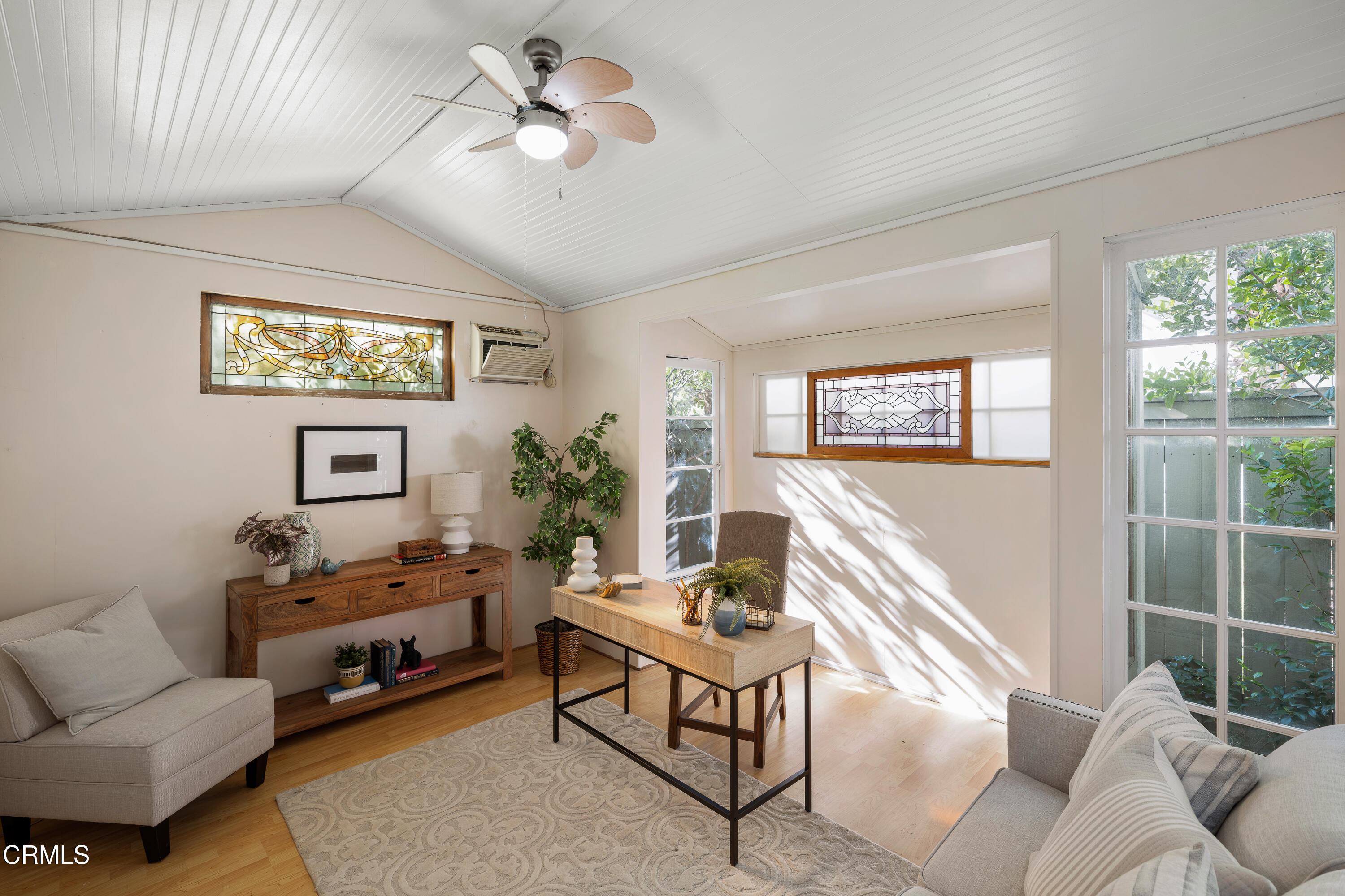 1073 Atchison Street Pasadena, CA 91104 - Photo 56 of 66 a living room with furniture a window and a flat screen tv