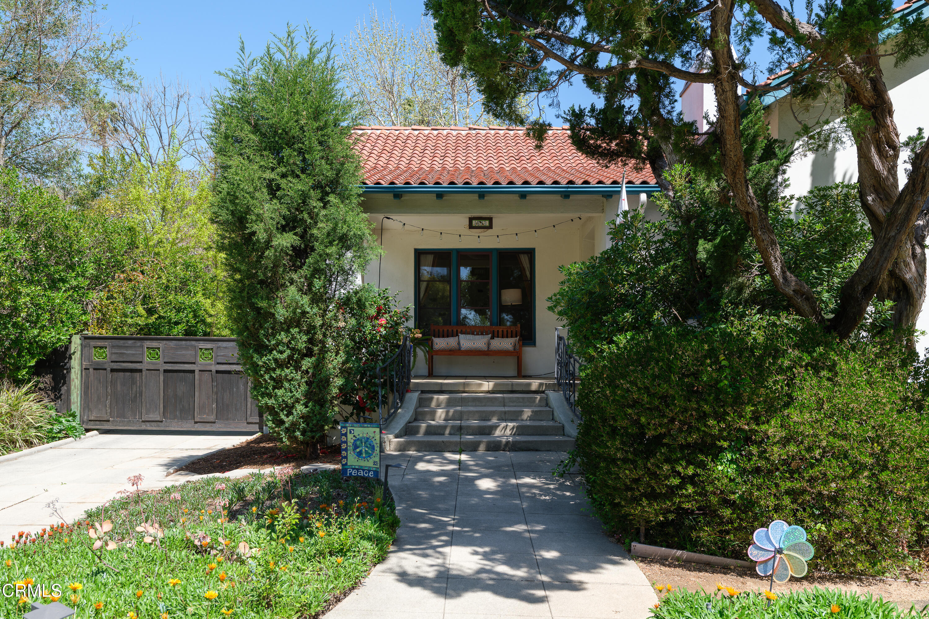 1073 Atchison Street Pasadena, CA 91104 - Photo 6 of 66 a view of a house with potted plants and large trees