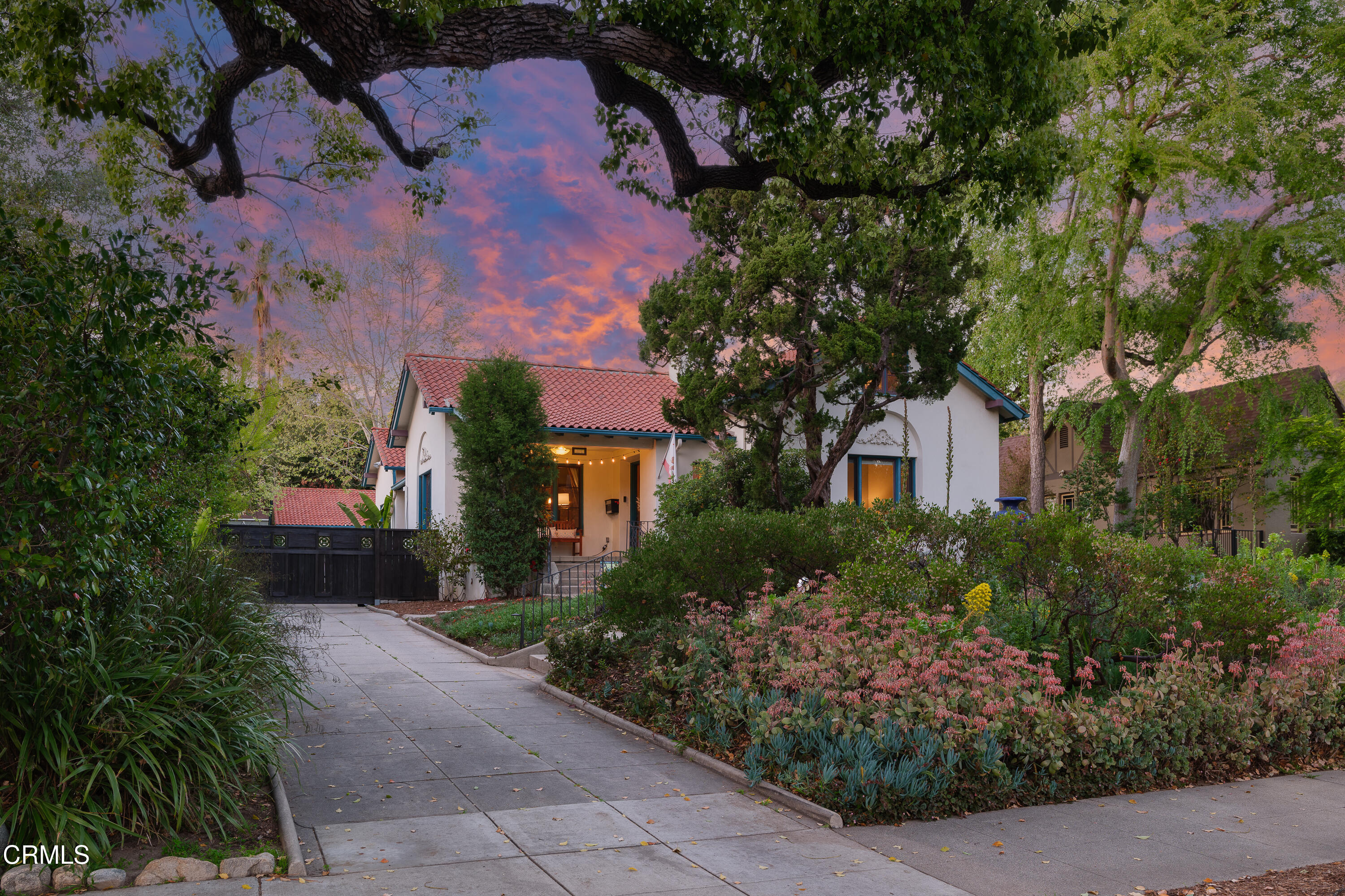 1073 Atchison Street Pasadena, CA 91104 - Photo 65 of 66 a front view of a house with a yard and tree s