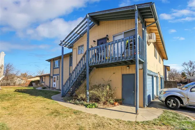 a view of a house with a snow in the yard