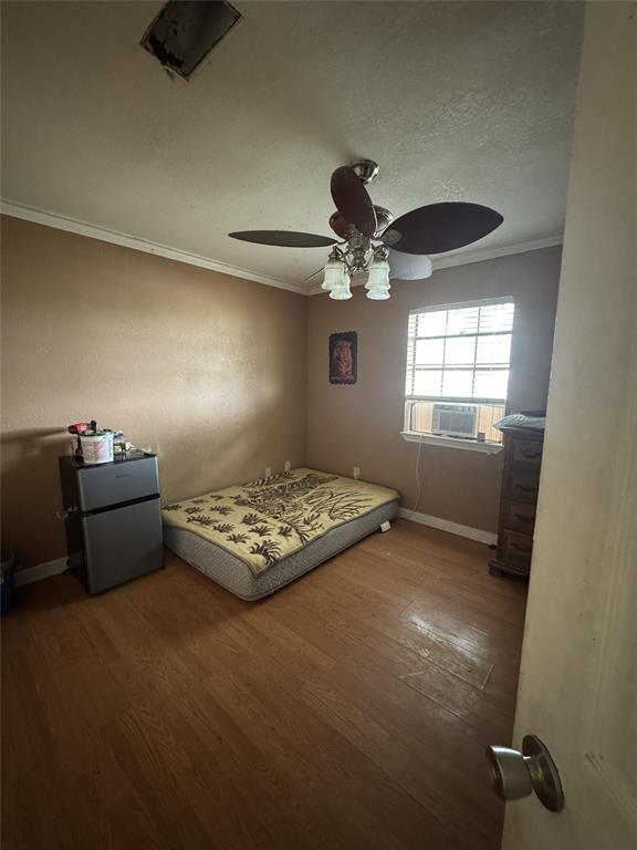 636 East Kempner Street Mabank, TX 75147 - Photo 15 of 28 Wood-finish flooring throughout, complemented by a ceiling fan with integrated lighting