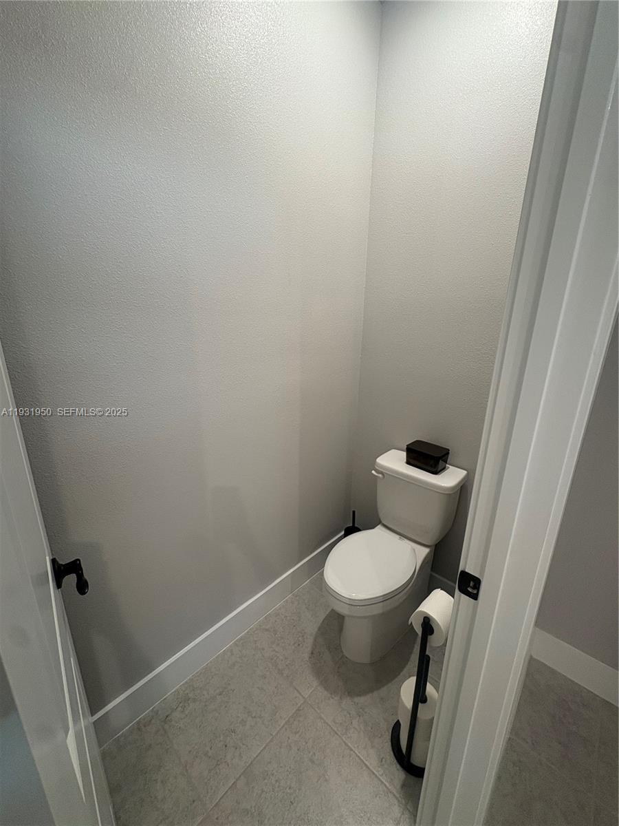 5020 124th Avenue East Parrish, FL 34219 - Photo 23 of 25 a white toilet sitting next to a sink