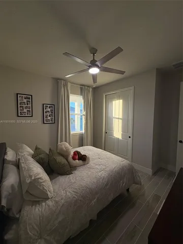 a bedroom with double bed and a window