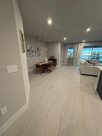 a large white kitchen with lots of counter space