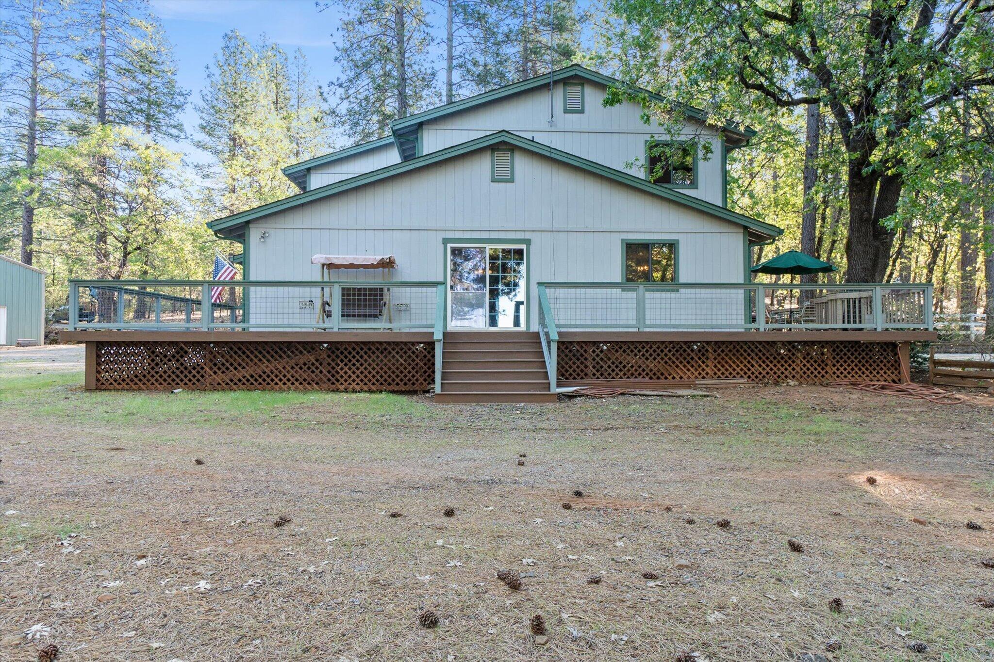 26997 Lookout Mountain Road Oak Run, CA 96069 - Photo 62 of 92 a view of a small house with a yard