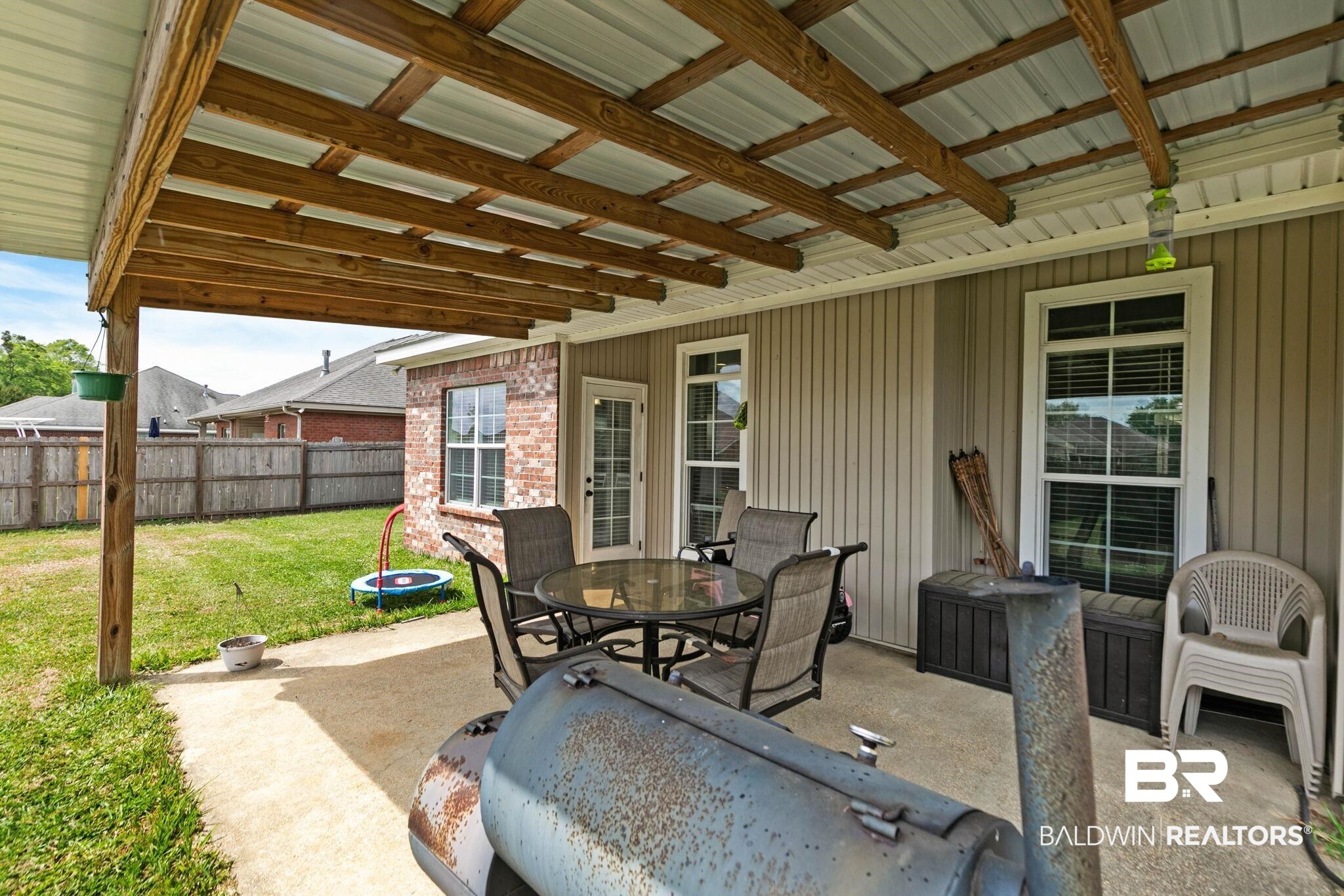 9177 Labrador Trail Theodore, AL 36582 - Photo 22 of 24 View of patio / terrace featuring outdoor dining area