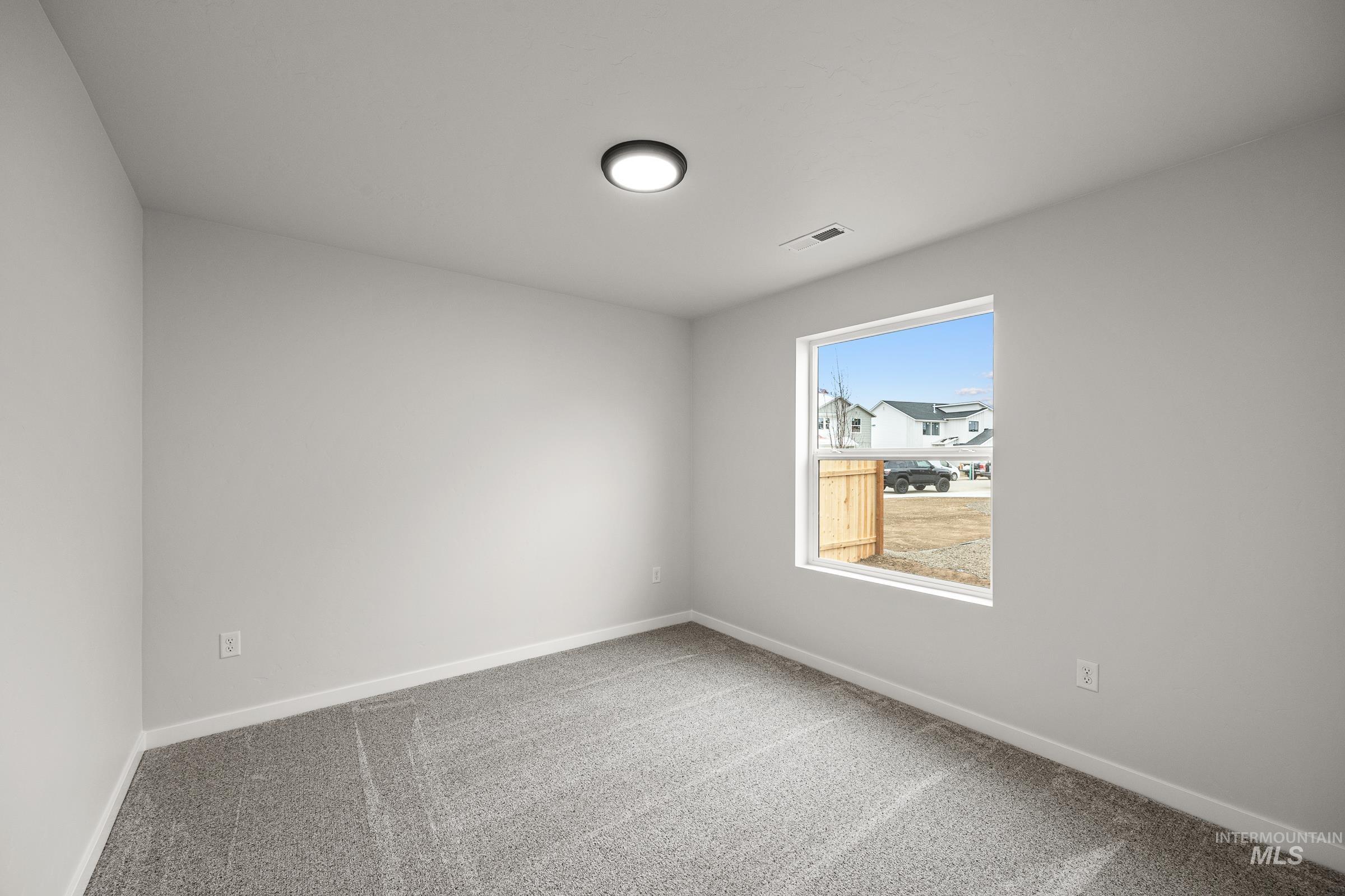 13654 Inman Court Caldwell, ID 83607 - Photo 15 of 25 Carpeted empty room with baseboards
