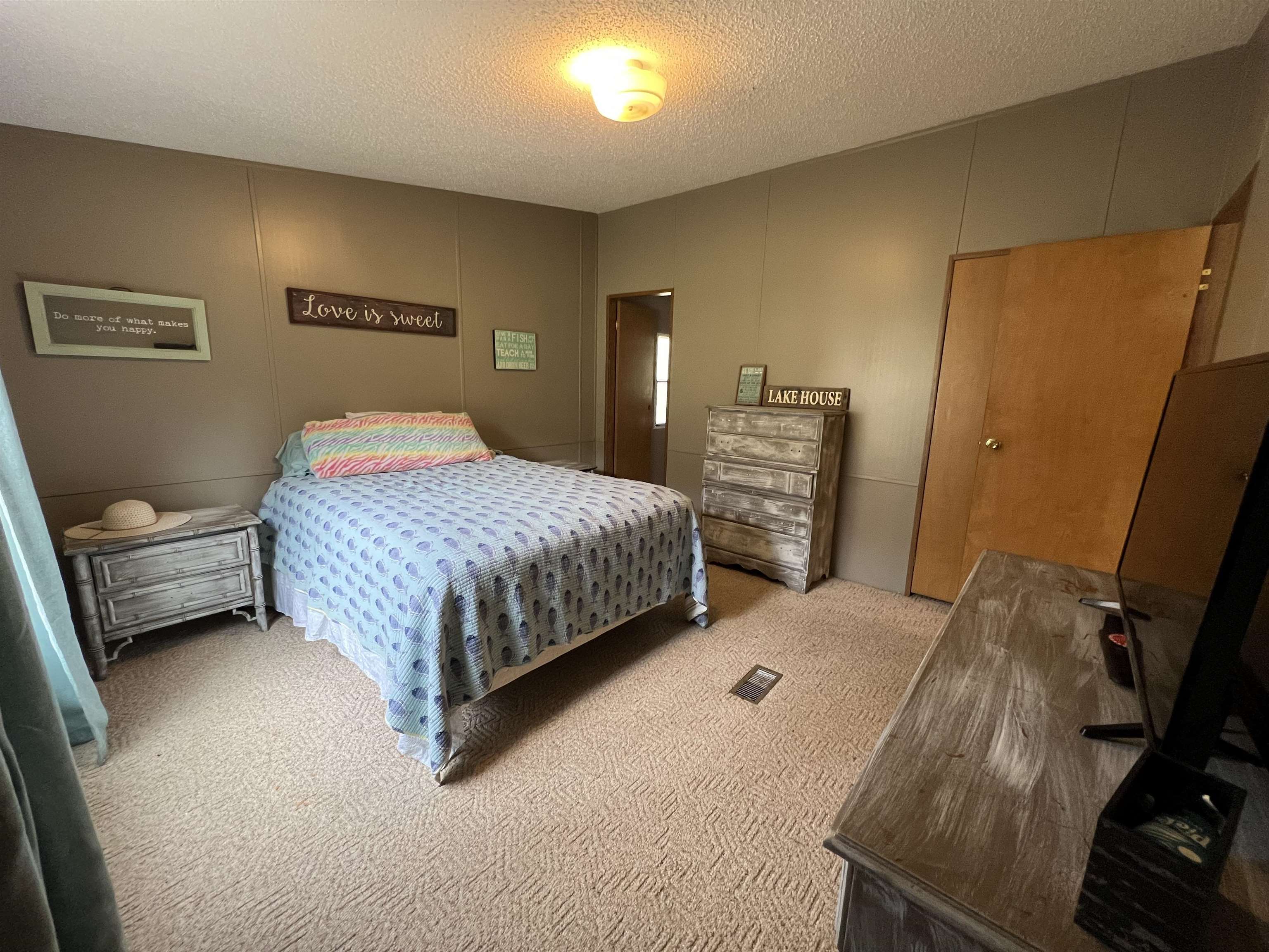 1405 Bruton Branch Road Savannah, TN 38372 - Photo 13 of 20 Bedroom with carpet flooring and a textured ceiling