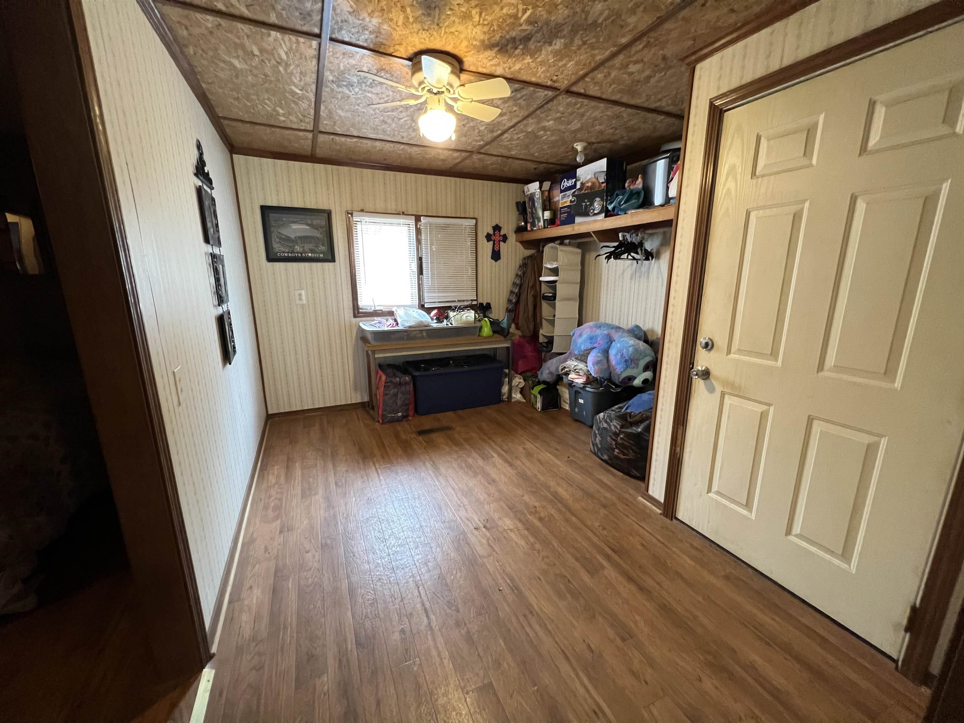 1405 Bruton Branch Road Savannah, TN 38372 - Photo 20 of 20 Interior space featuring baseboards, ceiling fan, wood finished floors, and an ornate ceiling