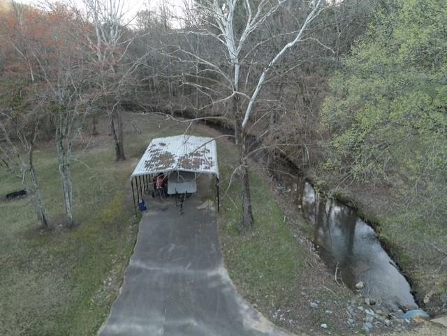 1405 Bruton Branch Road Savannah, TN 38372 - Photo 3 of 20 Drone / aerial view with a forest view