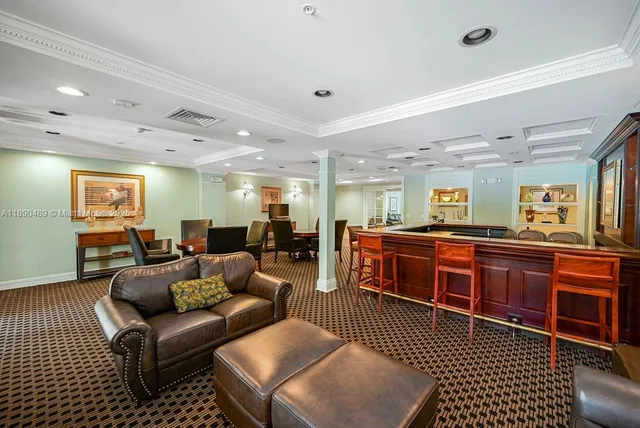 a living room with furniture a couch and a dresser