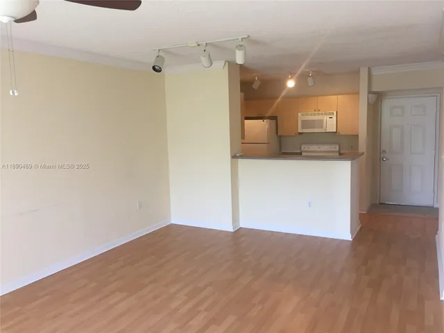 a view of a kitchen from the hallway