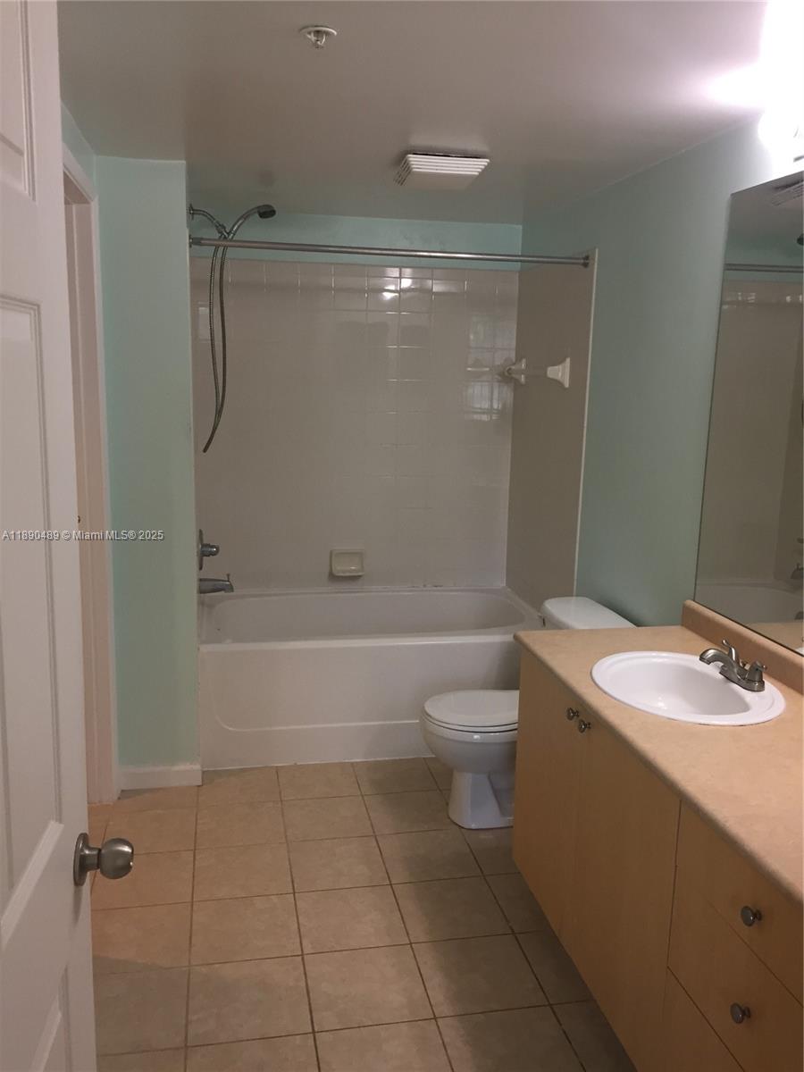 1919 Van Buren Street, Unit 416A Hollywood, FL 33020 - Photo 8 of 17 a bathroom with a sink a toilet and shower
