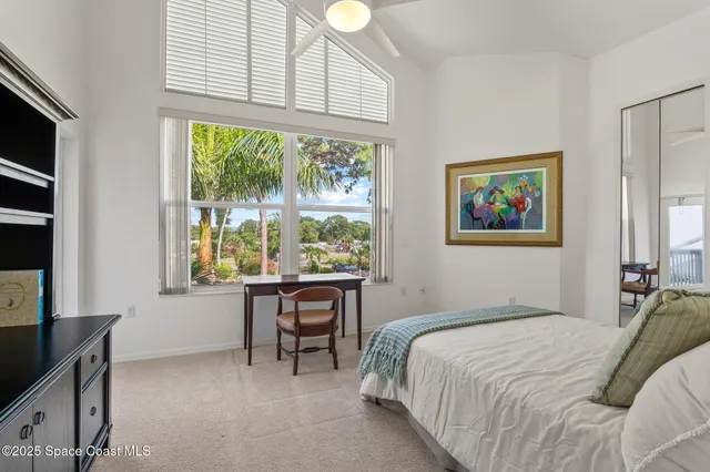 a view of a swimming pool with a patio and a yard