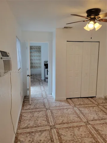 a view of a hallway with a chandelier