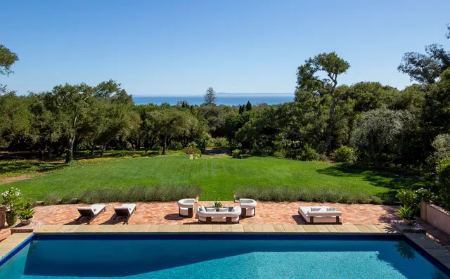 a view of a swimming pool with a patio