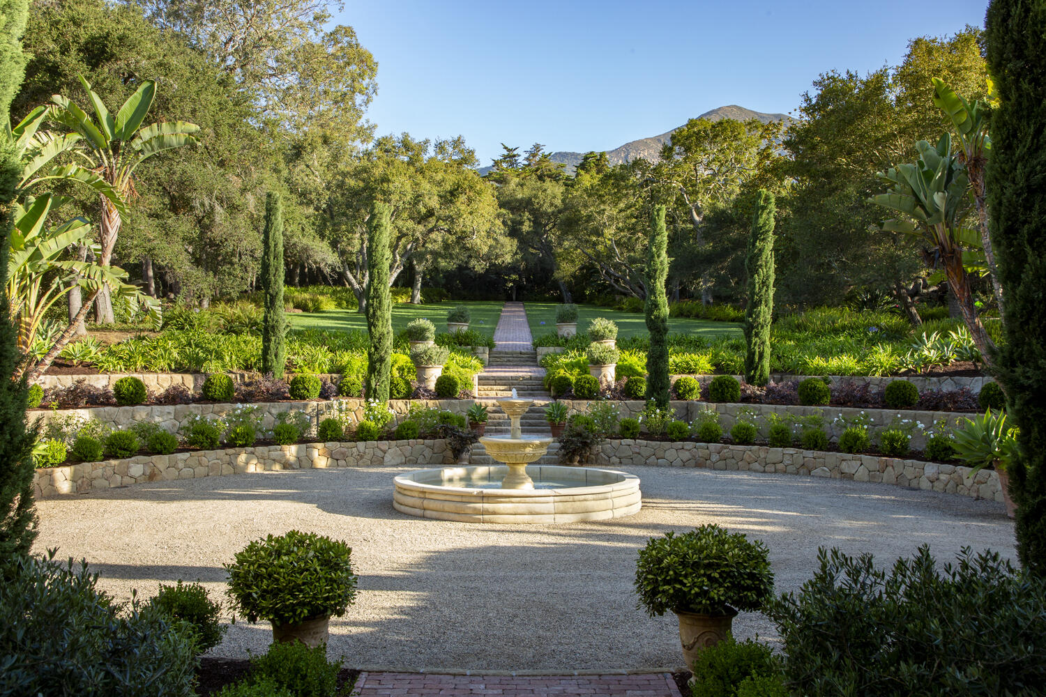 670 Hot Springs Road Montecito, CA 93108 - Photo 19 of 23 a view of a fountain with tree in front of it