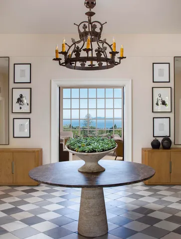 a view of a dining room with furniture and chandelier