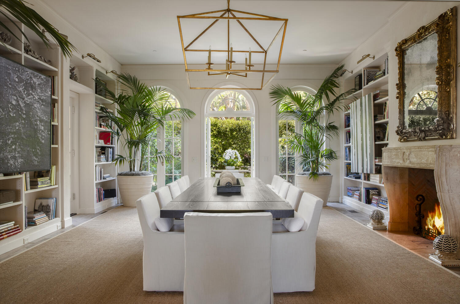 670 Hot Springs Road Montecito, CA 93108 - Photo 10 of 23 a dining room with fireplace furniture and a chandelier