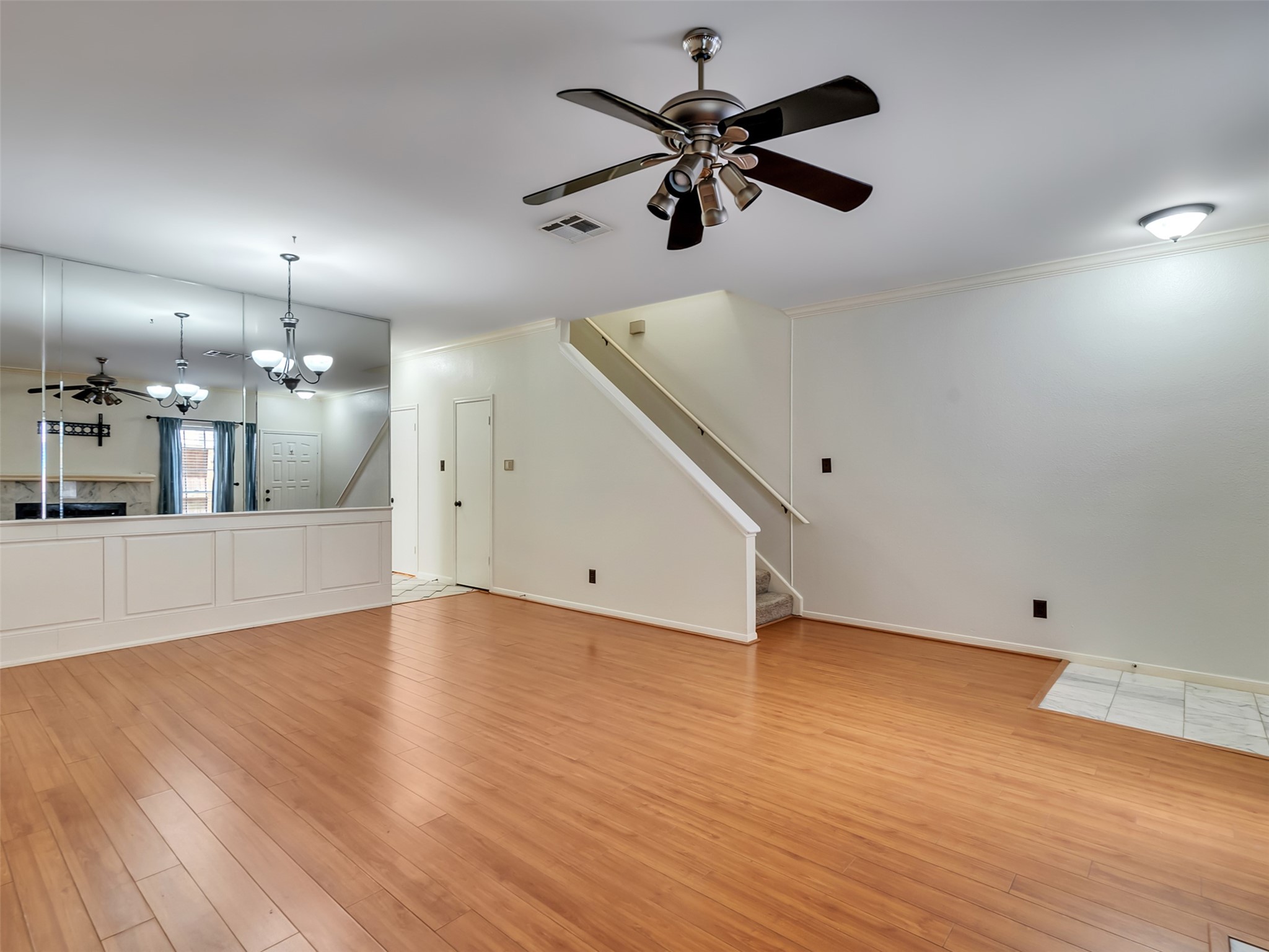 4001 Tanglewilde Street, Unit 605 Houston, TX 77063 - Photo 6 of 29 wooden floor in an empty room with a window